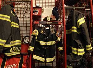 AP Photo/Kathy WillensA miniature firefighter's jacket and helmet belonging to six year-old cancer victim Liam Witt hangs beside its adult-sized equivalents at Engine Co. 1 and Ladder Co. 24in New York prior to a memorial service for Witt on Monday.