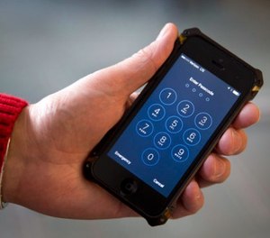 In this Feb. 17, 2016, file photo an iPhone is seen in Washington.