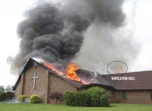 Photo Star Press/NIOSHThe roof of the church has collapsed into the sanctuary after the steeple fell on top of it. Note the fire blowing from the ventilation hole.