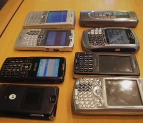 Illegal smartphones like the BlackBerry and iPhone are finding their way inside the wire, and they are dramatically increasing the threat from inmates. (jurvetson/flikr)