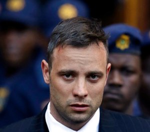 In this June 15, 2016, file photo, Oscar Pistorius leaves the High Court in Pretoria, South Africa, after his sentencing proceedings. (AP Photo/Themba Hadebe, File)