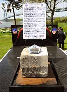 Photo FDNYThe stone is displayed in front of pictures of fallen 9/11 firefighters.