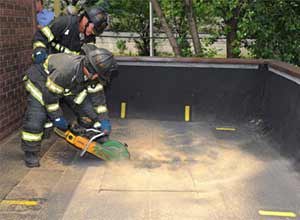 Photo FDNYFirefighters demonstrate how firefighters from across the city will use the Roof Operations Training Simulator.