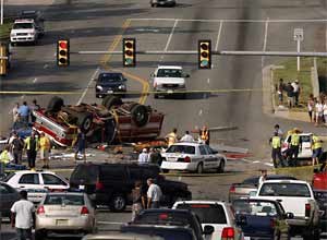 Photo Jared Soares / The Roanoke TimesResponders block off the crash site.