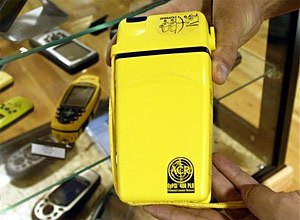AP Photo/Ted S. Warren, FileA personal locator beacon made by ACR Electronics, Inc. is seen beside other GPS units.