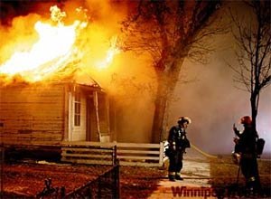 Photo Boris Minkevich/Winnipeg Free PressThis Free Press photo shows a firefighter posing as another snaps a cell phone photo, sparking interest from across the continent.
