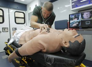 Photo Rodger Mallison/Star-TelegramRonnie Ikeler, EMS specialist for HCA North Texas, demonstrates iStan, a training manikin in an ambulance simulator.