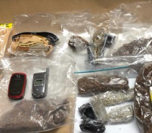 Officials said the women were attempting to smuggle in contraband that contained tobacco, marijuana, cellphones and a pill that tested positive for ecstasy