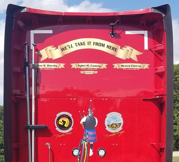 The names of fallen firefighters are emblazoned on the back of the Memorial Run truck. (Photo/Randall Rogers)