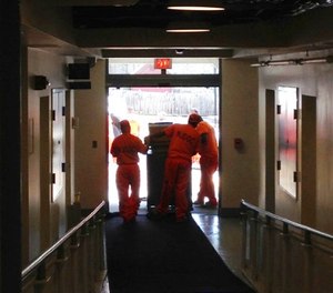 New Jersey’s corrections department said that one of its officers was wrong when he demanded that an Associated Press reporter delete the photograph of inmates working at the statehouse.