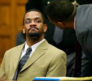In this Wednesday, Feb. 27, 2008, file photo, Bobby Cutts Jr., left, talks with his attorney Fernando Mack after the jury recommended a sentence, in Canton, Ohio. (Scott Heckel/The Canton Repository via AP, Pool, File)