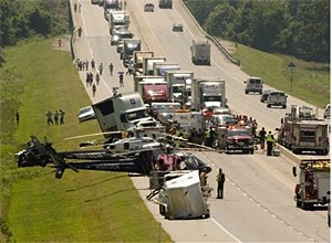 AP Photo/Gary CrowRescue workers and authorities work at the scene.