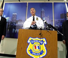 Cleveland Police Chief Michael McGrath, center, announces the results of disciplinary hearings for officers involved in a deadly chase on Oct. 15.