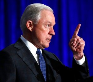 In this June 21, 2017 file photo, Attorney General Jeff Sessions speaks in Bethesda, Md. Sessions is visiting the Guantanamo Bay detention facility, which he has called a fine place to house new terrorism suspects.