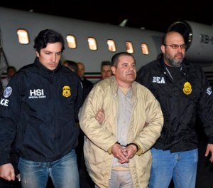 In this Jan. 19, 2017, file photo provided U.S. law enforcement, authorities escort Joaquin