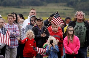 Audience members attend the September 11th Flight 93 Memorial Service, Tuesday, Sept. 11, 2018, in Shanksville, Pa. President Donald Trump is marking 17 years since the worst terrorist attack on U.S. soil by visiting the Pennsylvania field that became a Sept. 11 memorial. (AP Photo/Evan Vucci)