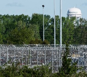 A fence surrounds the Lee Correctional Institution on Monday, April 16, 2018, in Bishopville, S.C. Multiple inmates were killed and others seriously injured amid fighting between prisoners inside the maximum security prison in South Carolina.