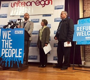 In this Feb. 1, 2017 file photo, ACLU of Oregon legal director Mat dos Santos speaks at a news conference in Portland to announce a federal lawsuit filed in U.S. District Court in Portland against President Donald Trump's executive immigration order. A rights group has filed an emergency suit in federal court against top officials of U.S. immigration and homeland security departments, alleging they have unconstitutionally denied lawyers' access to immigrants being held in a federal prison in Oregon. (AP Photo/Gillian Flaccus, File)