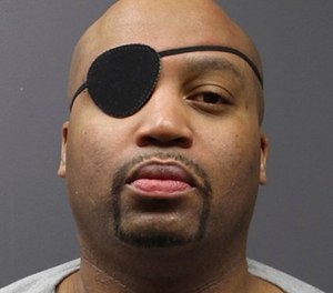 In this undated file photo provided by the Minnesota Department of Corrections, Edward Muhammad Johnson is shown in a mugshot. The Minnesota prison inmate serving time for murder is now charged with killing a corrections officer at the prison last month.