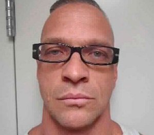 This undated file photo provided by Nevada Department of Corrections photo shows death row inmate Scott Raymond Dozier, who was convicted in 2007 of robbing, killing and dismembering a 22-year-old man in Las Vegas, and was convicted in Arizona in 2005 of another murder and dismemberment near Phoenix.
