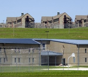 Maximum security housing units at the new Jefferson City Correctional Center sit below dormitory-style housing at a the minimum security Algoa Correctional Center Thursday, June 24, 2004, in Jefferson City, Mo.