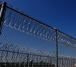 Razor wire lines the fence outside the Tipton Correctional Center March 24, 2007, in Tipton Mo.