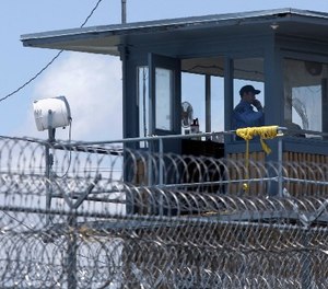 In this photo taken May 13, 2011, a guard is shown in a tower at the Arkansas Department of Correction Tucker Unit near Tucker, Ark.