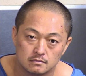 This photo provided by Fresno County Sheriff shows Thong Vang. Two unarmed officers were critically injured after being shot by Vang, a visitor in the lobby of a central California jail, authorities said Saturday, Sept. 3, 2016.