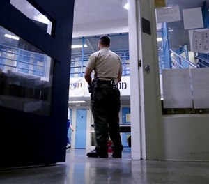 A Sheriff officer stands guard over inmates at the Twin Towers Correctional Facility Thursday, April 27, 2017, in Los Angeles.