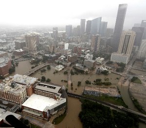 Downtown Houston is surrounded by floodwaters from Tropical Storm Harvey Tuesday, Aug. 29, 2017. (AP Photo/David J. Phillip)