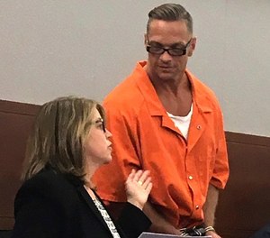 In this Aug. 17, 2017 file photo, Nevada death row inmate Scott Raymond Dozier confers with Lori Teicher, a federal public defender involved in his case, during an appearance in Clark County District Court in Las Vegas.
