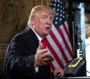 In a Sunday, Dec. 24, 2017 file photo, President Donald Trump turns to talk to the gathered media during a video teleconference in Palm Beach, Fla.