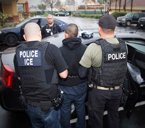 In this Feb. 7, 2017, photo released by U.S. Immigration and Customs Enforcement, foreign nationals are arrested during a targeted enforcement operation conducted by U.S. Immigration and Customs Enforcement (ICE) aimed at immigration fugitives, re-entrants and at-large criminal aliens in Los Angeles. (Charles Reed/U.S. Immigration and Customs Enforcement via AP, File)