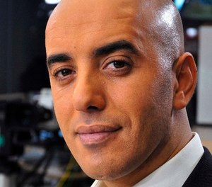 In this photo dated Nov. 22, 2010, notorious French criminal Redoine Faid poses prior to an interview with French all-news TV channel, LCI, as he was promoting his book, in Boulogne-Billancourt, outside Paris, France. (IBO/Sipa via AP)