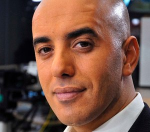 In this photo dated Nov. 22, 2010, notorious French criminal Redoine Faid poses prior to an interview with French all-news TV channel, LCI, as he was promoting his book, in Boulogne-Billancourt, outside Paris, France. (IBO/Sipa via AP)