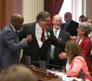 State Sen. Bob Hertzberg, second from left, celebrates with fellow Democratic state Senators after his bail reform bill was passed by the Calif. Senate on Tuesday. (AP Photo/Rich Pedroncelli)