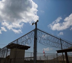 In this June 18, 2015, photo, a fence stands at Elmore Correctional Facility in Elmore, Ala. (AP Photo/Brynn Anderson)