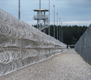 Razor wire protects a perimeter of the Lee Correctional Institution in Bishopville, S.C., Tuesday, Feb. 9, 2016.