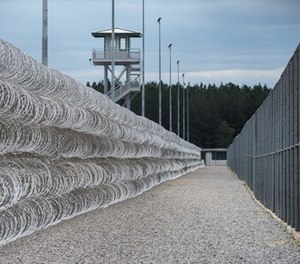 Razor wire protects a perimeter of the Lee Correctional Institution in Bishopville, S.C., Tuesday, Feb. 9, 2016.