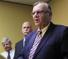 In this April 3, 2012, file photo, Maricopa County Sheriff Joe Arpaio, right, answers questions as one of his attorney John Masterson, middle, and the Sheriff's Deputy Director Jack MacIntyre, left, listen during a news conference in Phoenix. An audio recording of Arpaio making dismissive comments surfaced as the U.S. Justice Department had already launched a civil rights probe of his trademark immigration patrols and the FBI was already examining abuse-of-power allegations for the sheriff’s investigations of political foes.