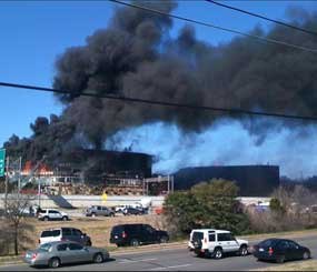 Smoke billows from a building after 53-year-old Joseph Stack piloted his small plane into it on Feb. 18, 2010. The building, which is in the same office complex as the Austin offices of the FBI, houses several government agencies, including the criminal investigation division of the IRS. (AP Photo)
