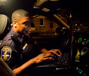 Through its work with IBM, the Charleston Police Department joins an elite group that includes New York, Vancouver, Northern Ireland, Memphis and many others that are using advanced analytics to gain a more accurate understanding of their data, detect patterns, preempt and forecast critical information to prevent incidents, and taking action in real time. Special Police Officer Earnest Terrell of the Charleston Police Department Team 4 prepares for his night shift. (Image by Jim Mossman, Courtesy of IBM)