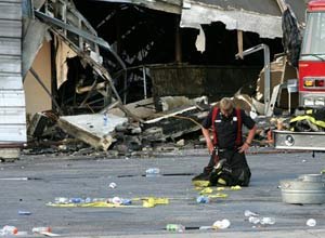 AP Photo/Alice KeeneyA firefighter takes a moment after helping to put out the fire that claimed the lives of nine Charleston firefighters.