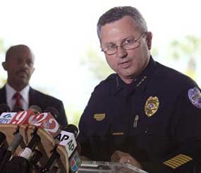 In this March 22, 2012 file photo, Sanford (Fla.) Police Chief Bill Lee speaks to the the media during as city manager Norton Bonaparte Jr. listens at left.