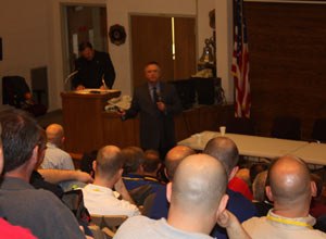 Chief Stephen Raynis outlines safety measures at the FDNY to attendees at the summit.