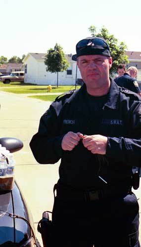 What’s the motivation for a man to risk his life as he puts together an explosive charge to blow down a door as he and his SWAT team prepare to battle a cop killer barricaded in his home?