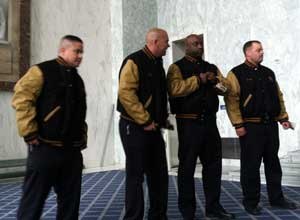 Photo PBIFirefighters Warren Deavers, Ramon Hounshell and Charles A. Ryan III along with Lt. Robert Alvarado of D.C. Fire and Emergency Medical Services Department try on their jackets awarded as part of the PBI Golden Knights.