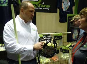 Photo Rick Markley
Zachary Green shows FoxFire's helmet bands during FDIC.