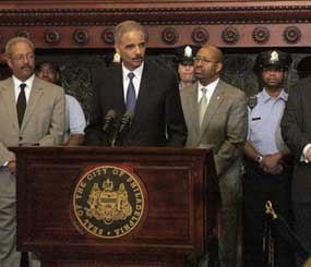 Attorney General Eric Holder addresses the media at Philadelphia City Hall on Monday, June 25, 2012. Holder announced more than $111 million in funding for more than 800 law enforcement positions across the country, including 44 in cities in Pennsylvania, through the U.S. Department of Justice Office of Community Oriented Policing Services.