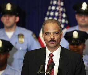 Attorney General Eric Holder makes remarks during a news conference at City Hall in Philadelphia, Tuesday, July 28, 2009. The Obama administration on Tuesday announced $1 billion in grants to help keep police officers on the beat during the economic downturn and tried to assure cities not getting aid that they won't be stiffed. (AP Photo/Matt Rourke) 